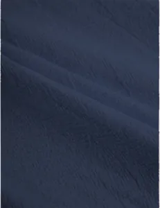Macro view showing the breathable textured weave of navy blue cotton linen fabric