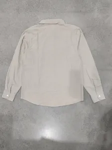 Detailed back view of a casual men's long-sleeve beige linen shirt for beach