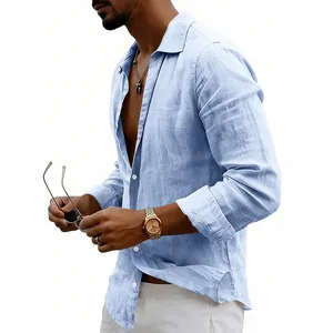 Close-up view of a light blue linen shirt texture and button details on male model