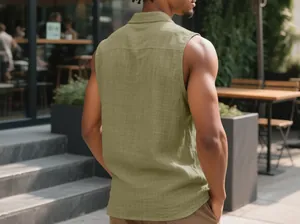 Back view of a men's olive green sleeveless linen shirt in a stylish outdoor setting