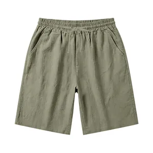 Detailed macro view of men's olive green linen casual shorts with elastic drawstring waist.