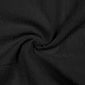 Detailed macro view of breathable black linen fabric texture for men's casual shirt