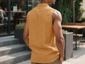 Back view of a men's casual sleeveless linen shirt in mustard yellow at an outdoor cafe