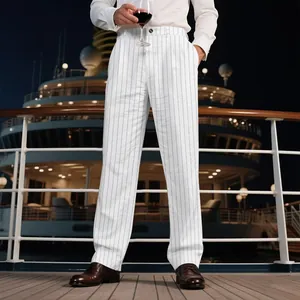Man wearing white linen striped straight-leg trousers on a luxury cruise ship deck