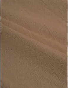 Macro texture shot of breathable linen-cotton fabric showing weave details in light brown
