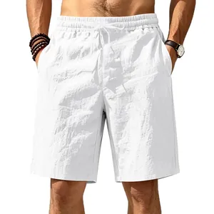 Detail view of men's white breathable cotton linen drawstring beach shorts