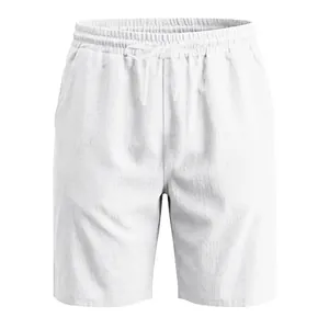 Macro view of men's white breathable linen beach shorts with elastic drawstring