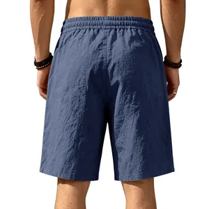 Back view of navy blue loose linen shorts showing breathable cotton linen texture