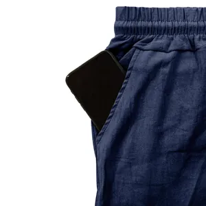 Close-up of deep side pocket on breathable navy blue linen casual pants for men