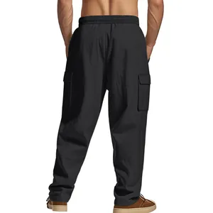 Detailed back view of men's loose black linen cargo pants featuring large functional side pockets