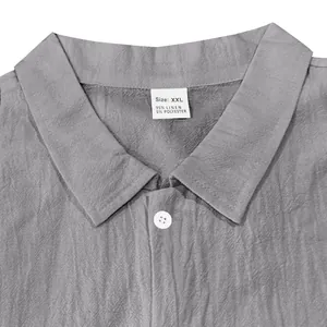 Close-up view of grey linen shirt collar showing XXL size and material content label