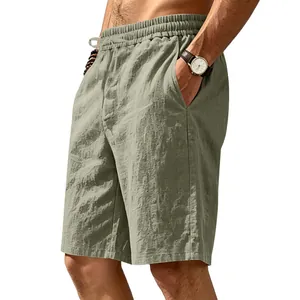 Close-up detail of men's breathable sage green linen casual shorts for summer beach