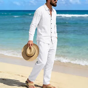 Men's white linen beach set featuring loose long-sleeve shirt and matching trousers