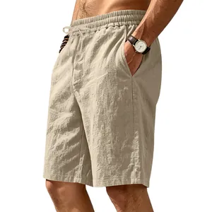 Detail of men's loose linen cotton beach shorts showing breathable fabric texture and fit