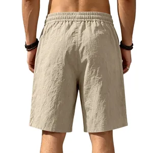 Rear view of khaki loose linen beach shorts for men showing detailed fabric texture