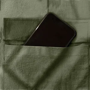 Close-up of olive green men's cargo pants pocket showing depth with a smartphone inside.