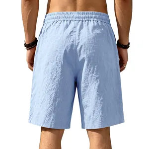 Detailed back view of light blue loose men's linen beach shorts with breathable cotton fabric