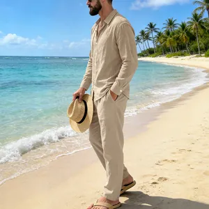 Male model wearing a casual beige linen shirt and pants set on a tropical sunny beach