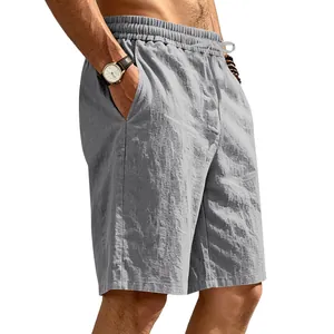 Detailed view of men's breathable grey linen casual beach shorts worn by a model