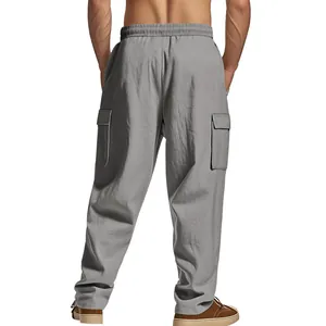 Back view of men's loose grey linen-style cargo pants with side pockets and elastic waist