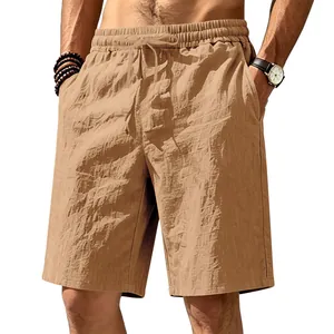 Detailed view of khaki linen shorts showing breathable fabric texture and drawstring waist