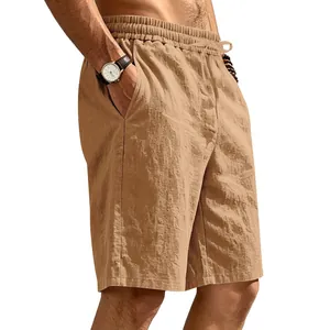 Close-up of men's breathable khaki linen shorts with drawstring waist and pockets.