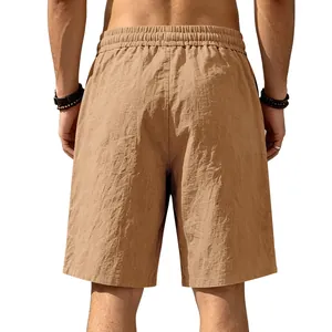 Back view of men's loose linen casual shorts in tan color for summer beach