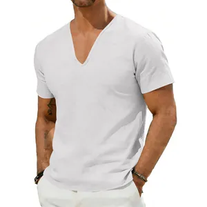 Close-up of men's white V-neck linen shirt showing relaxed fit and breathable texture