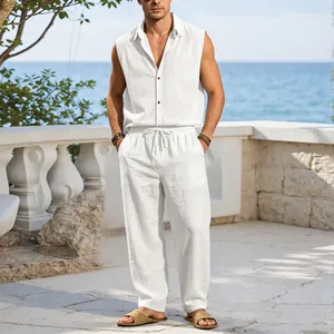 Detailed view of men's white linen sleeveless shirt and matching drawstring pants