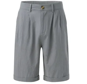 Front view detail of men's grey pleated linen shorts featuring button waist and cuffed hem