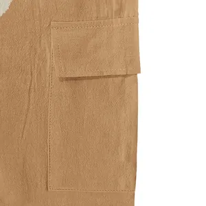 Close-up detail of a functional cargo pocket on breathable men's linen summer trousers