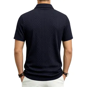 Detailed macro view of the navy blue jacquard texture on the back of a men's Polo shirt