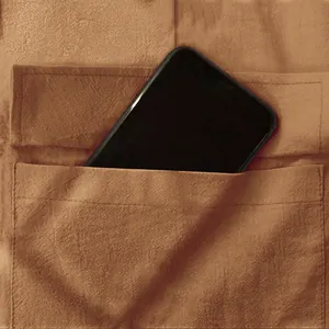 Macro view showing the functional deep pocket of men's brown linen breathable cargo pants