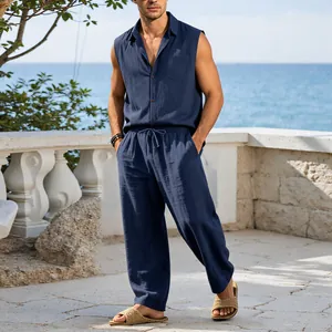 Men's navy linen sleeveless shirt and trousers set for breathable summer vacation wear.
