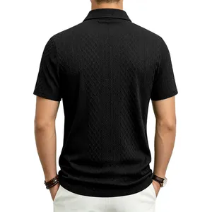 Back view detail of men's black jacquard polo shirt with textured diamond pattern fabric