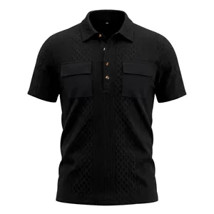 Detail view of black men's jacquard polo shirt featuring dual flap chest pockets.