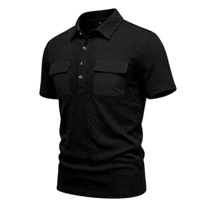 Detailed macro view of black men's jacquard polo shirt with dual utility chest pockets