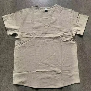 Detailed view of men's linen v-neck shirt featuring a natural crinkled texture