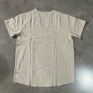 Detailed view of the back of a men's beige V-neck linen short sleeve shirt with natural texture