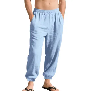 Detailed close-up of men's light blue breathable cotton linen jogger pants with drawstring