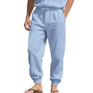 Men's breathable light blue cotton linen joggers with elastic waist and drawstring.
