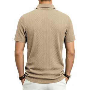 Back view of men's beige short-sleeve Polo shirt showing detailed jacquard texture.