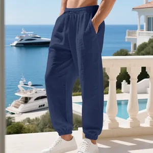 Men's navy linen casual jogger pants with drawstring and pockets for beach resort style.