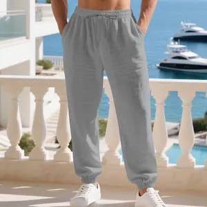 Detail of grey men's linen joggers showing breathable fabric texture and elastic cuffs