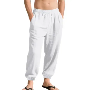 Detail of men's white breathable linen jogger pants with drawstring waist and elastic cuffs