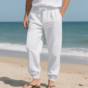 Detail showing the breathable linen fabric and elastic cuffs of men's white beach joggers