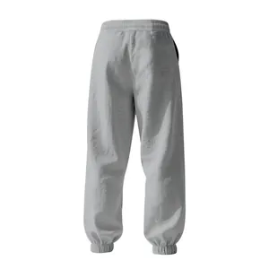 Detailed back view of men's loose cotton linen casual jogger pants in light grey