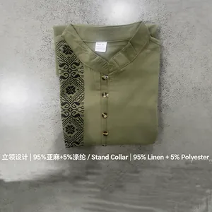 Detail view of olive green linen Henry shirt featuring ethnic print and stand collar