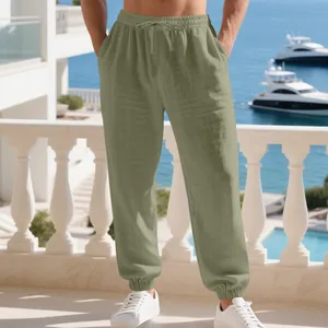 Men's olive green linen casual joggers with drawstring waist and elastic cuffs for beachwear.
