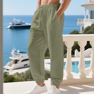 Men's olive green linen joggers featuring a comfortable drawstring waist and elastic cuffs